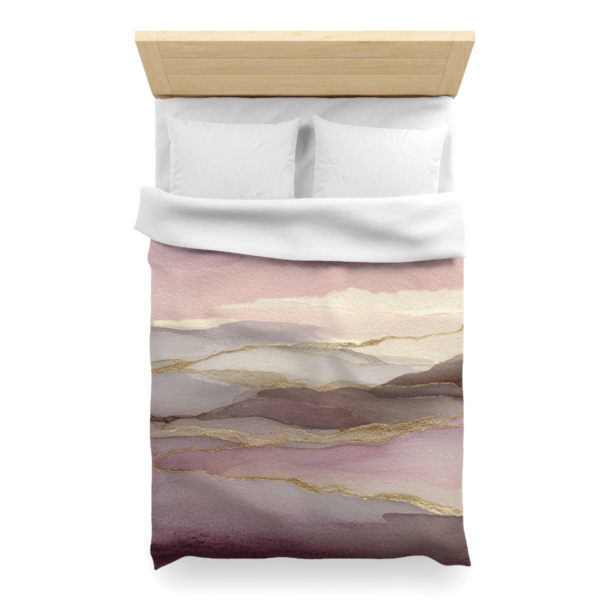 a bed with a white comforter and pillows, and the bed is set against a white background.