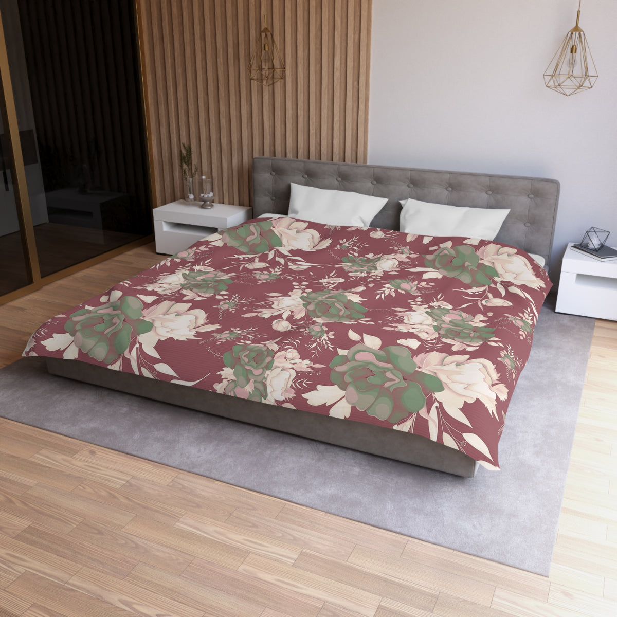 a modern bedroom with a large bed covered in a floral print comforter. The bed is positioned against a wall with a wooden panel. The room also features a nightstand, a pendant light, and a mirror.