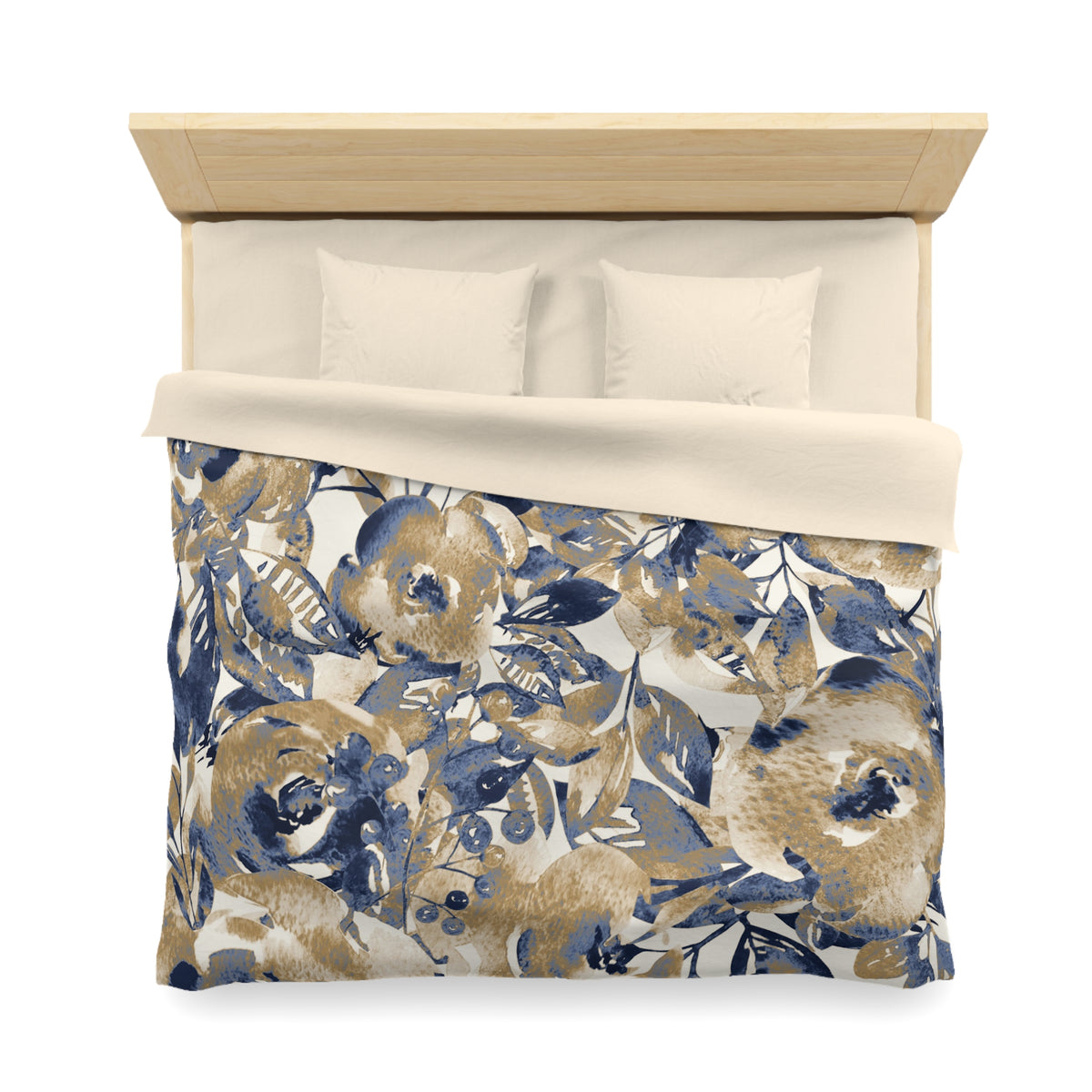 a bed with a floral print comforter and pillows.