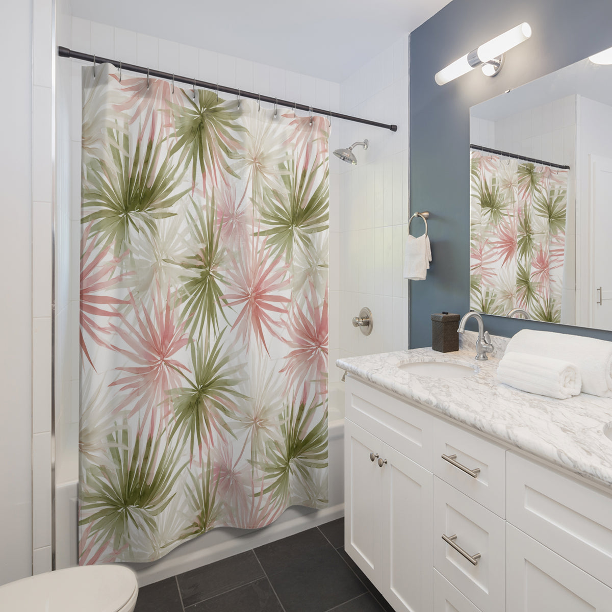 a modern bathroom with a white vanity, a shower curtain with a tropical plant print, and a mirror above the vanity.