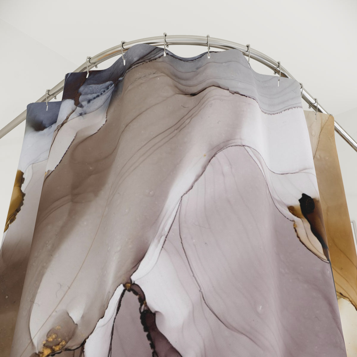 a shower curtain with a unique abstract pattern, hanging from a metal rod.