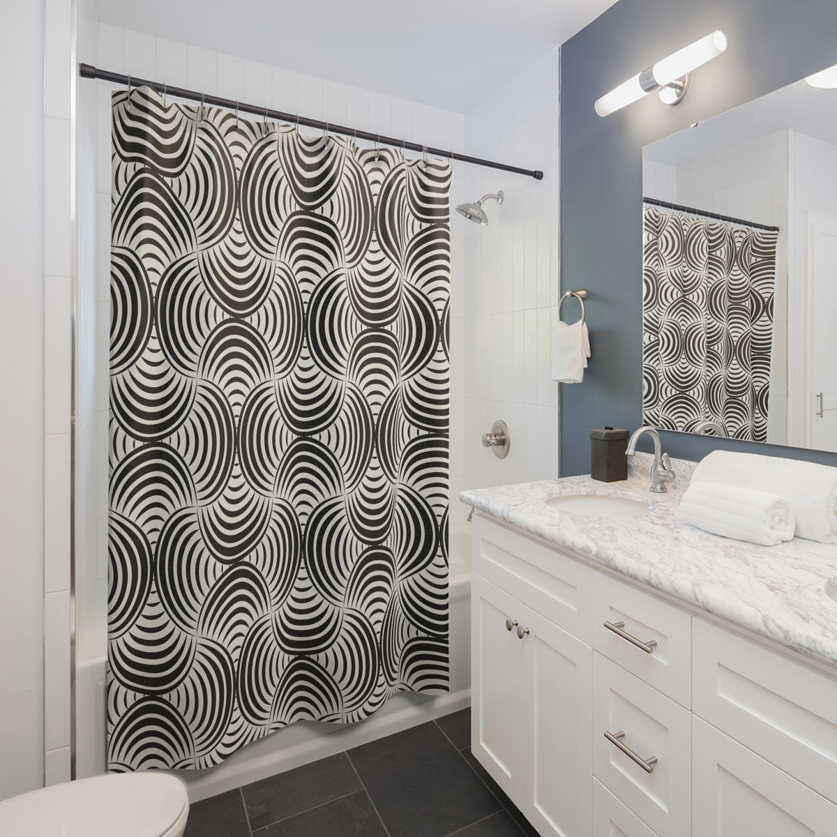 a modern bathroom with a white vanity, a black and white patterned shower curtain, and a mirror above the vanity.