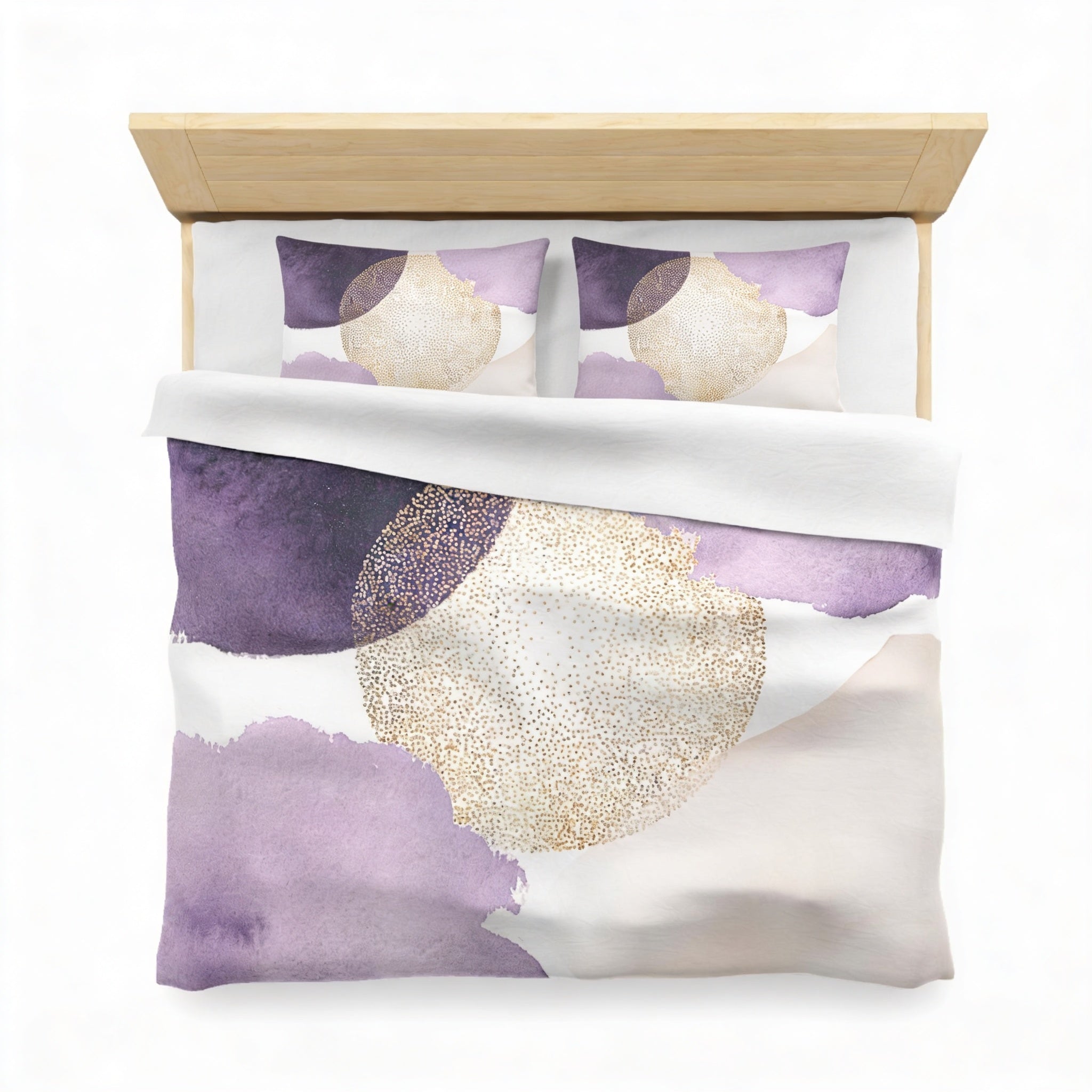 a bed with a purple and gold patterned comforter and matching pillows.