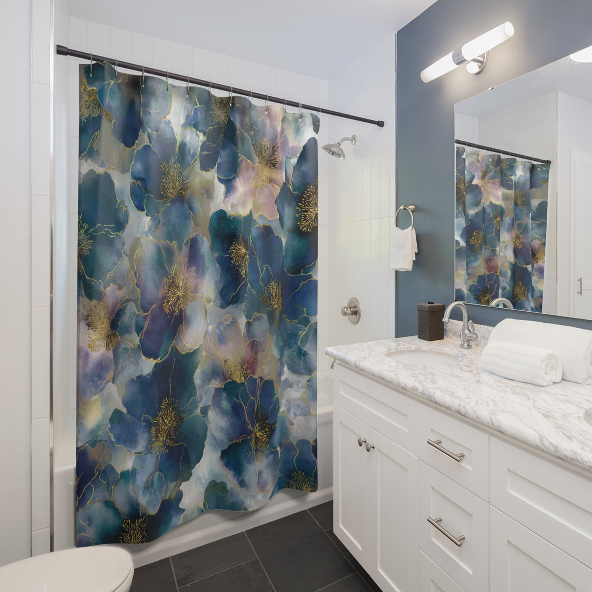 a modern bathroom with a white vanity, a shower curtain with a floral pattern, and a mirror above the vanity.