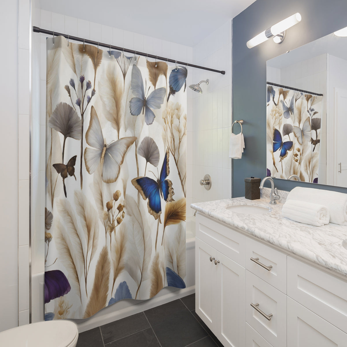 a bathroom with a shower curtain featuring a floral design of butterflies and leaves in various shades of brown, white, and blue. The bathroom has a white vanity with a marble countertop and a mirror above it.