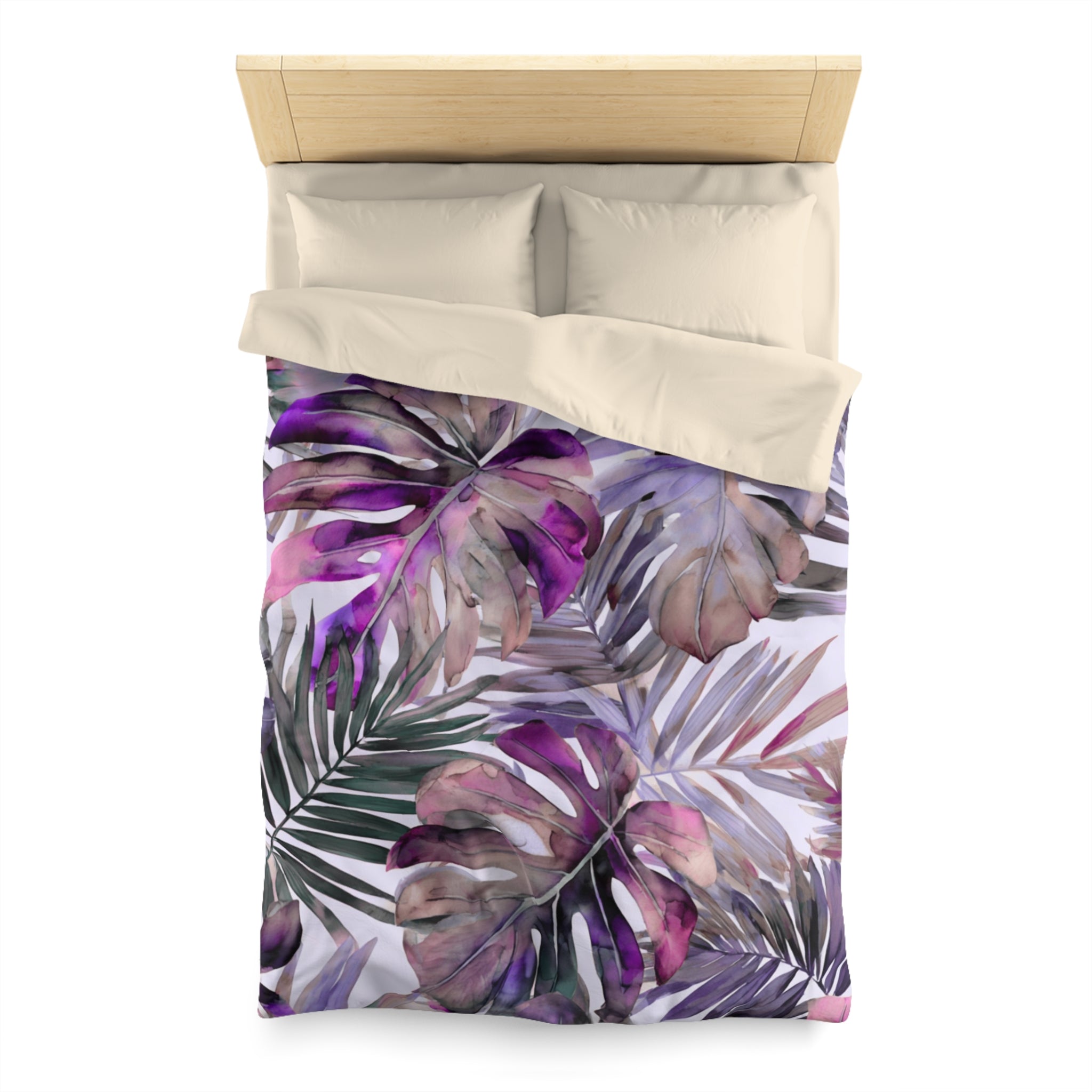 a bed with a colorful, tropical-themed bedspread featuring large, vibrant leaves in shades of purple and green.