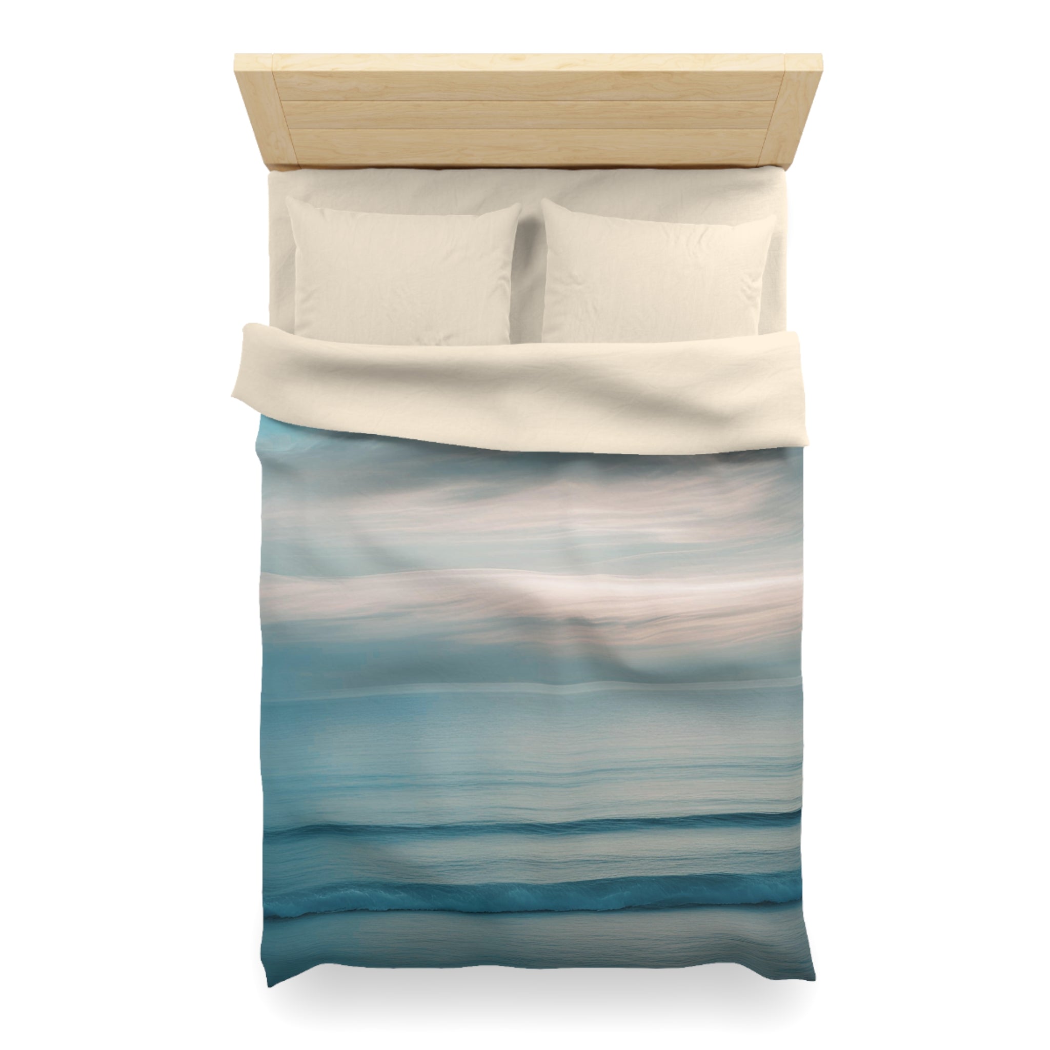 a neatly made bed with a blue and white striped comforter and two white pillows.