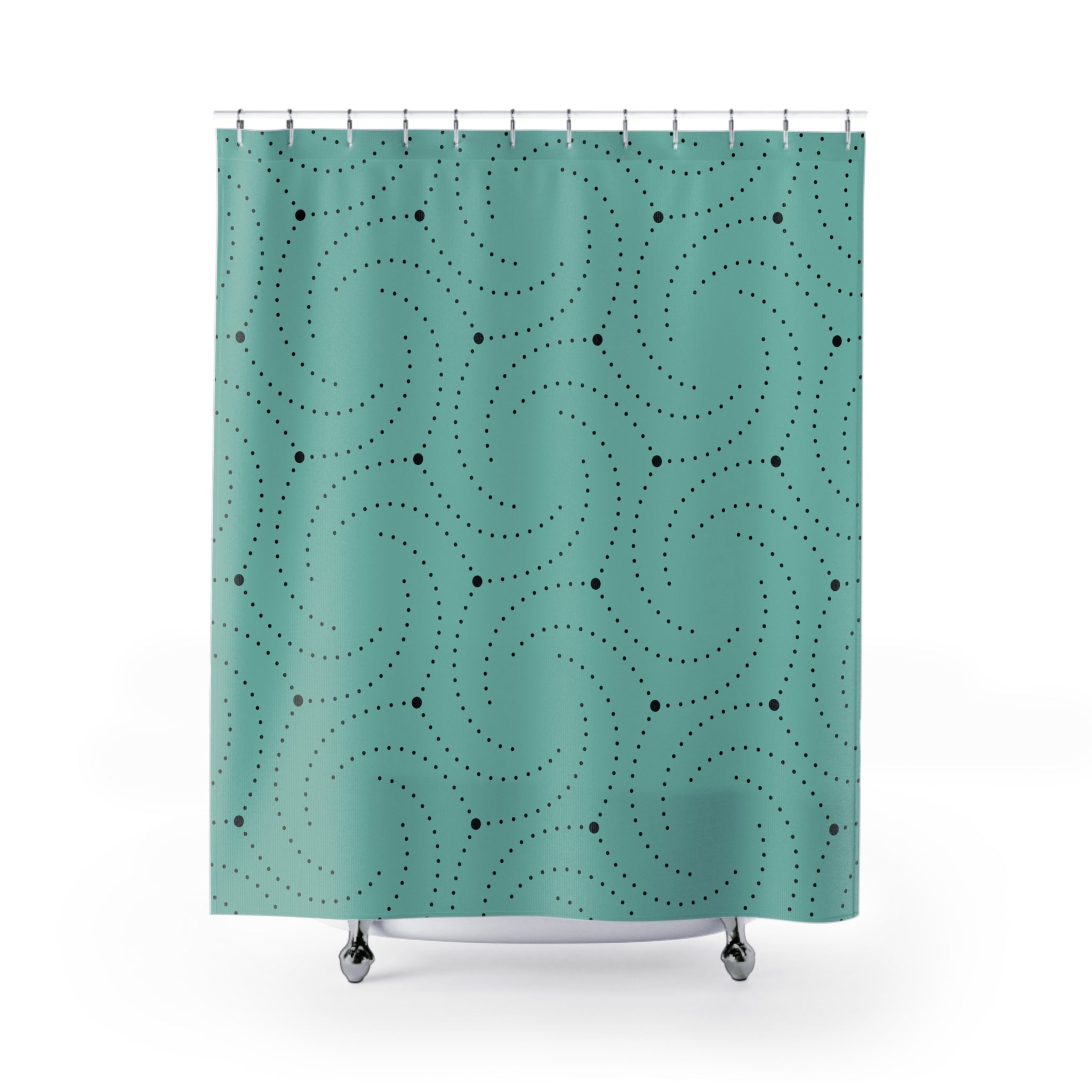 a green shower curtain with black dots on it