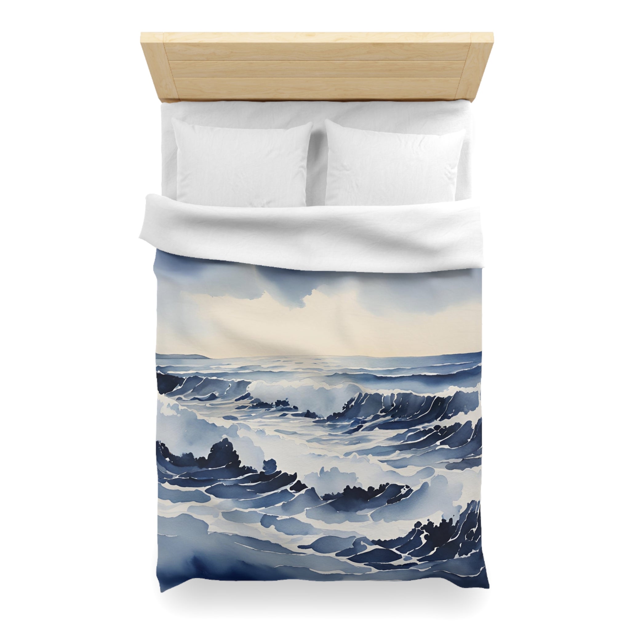a bed with a white comforter and pillows, featuring a watercolor painting of a seascape on the comforter.