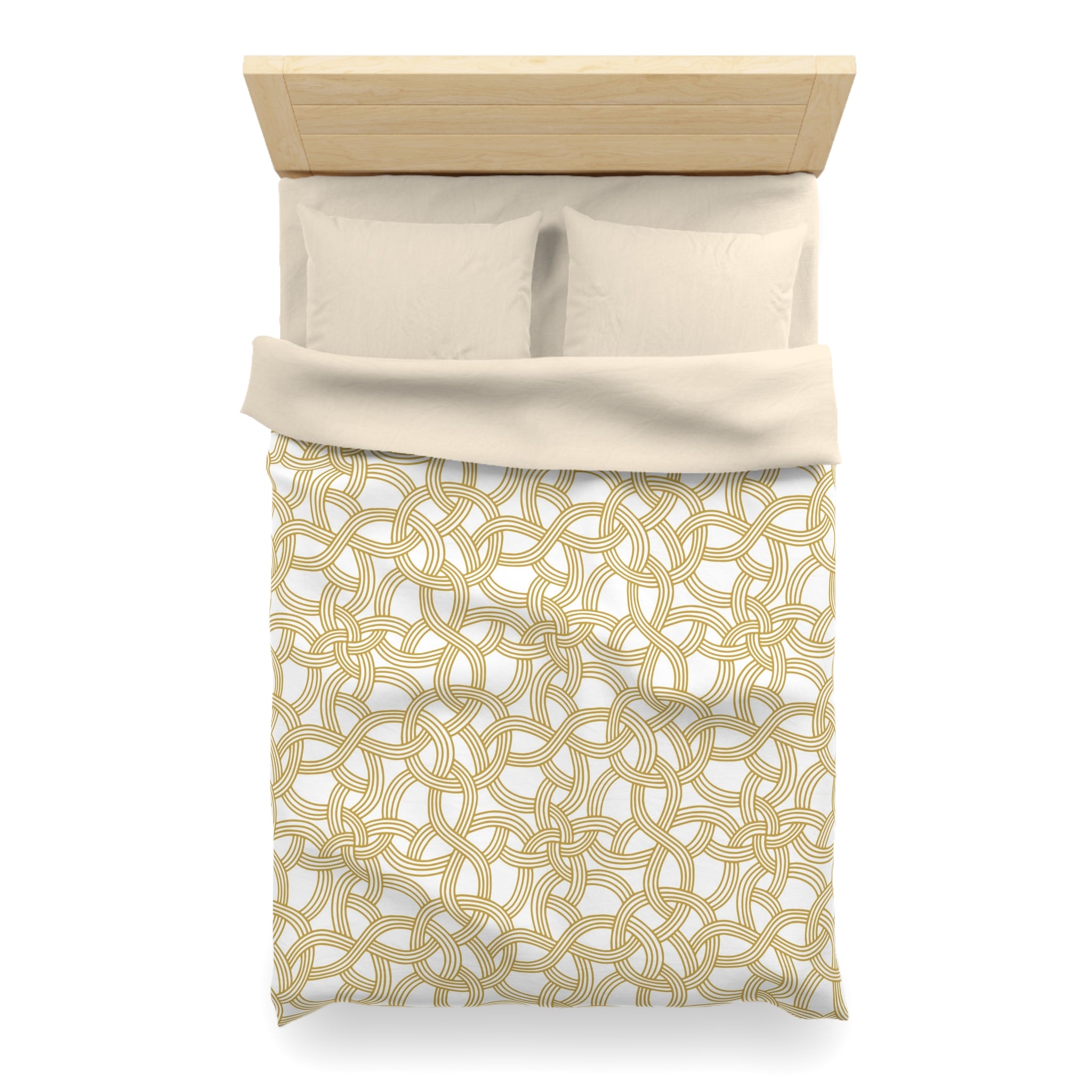 A neatly made bed with a beige comforter and a gold patterned blanket.