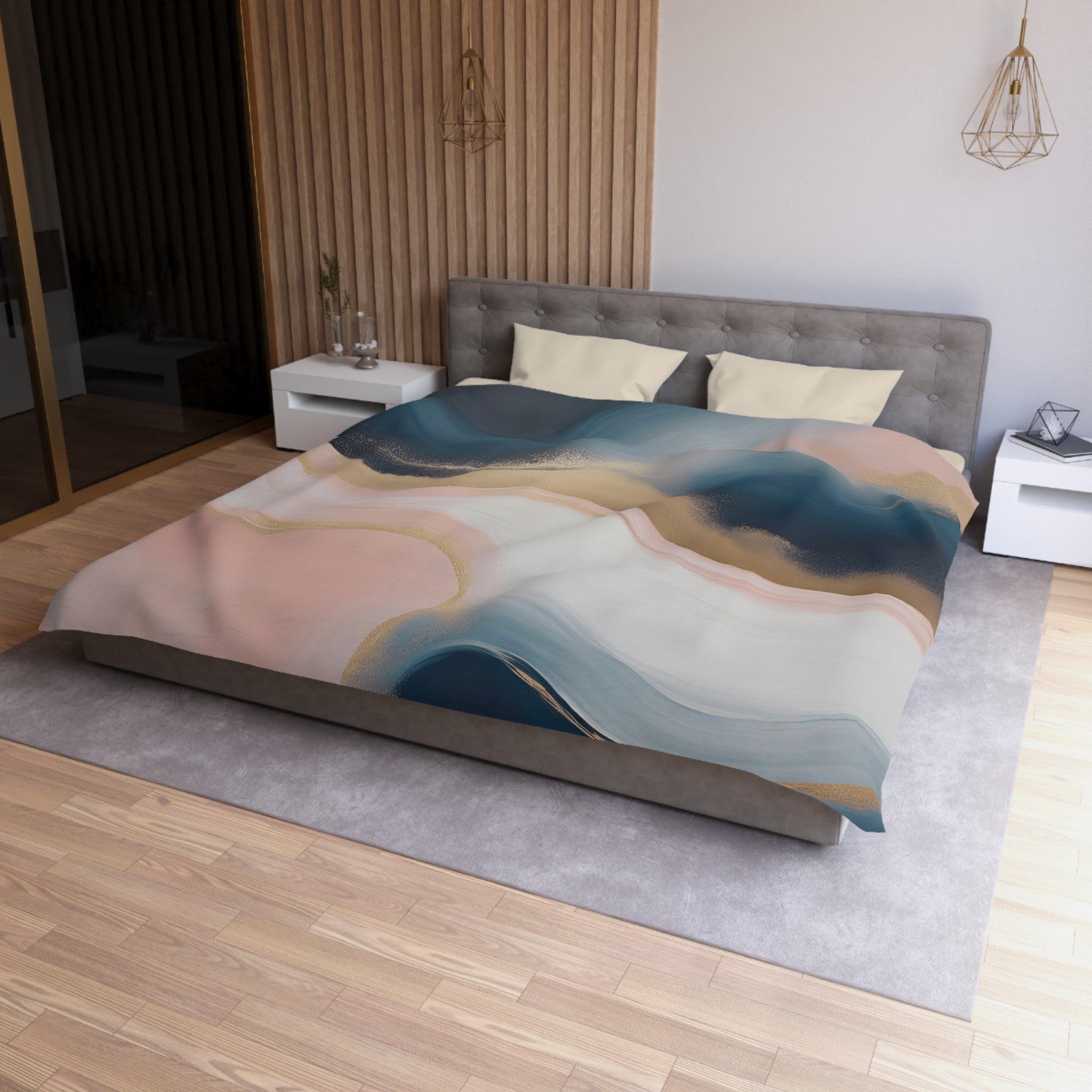 a modern bedroom with a large bed, a gray headboard, and a colorful abstract patterned comforter. The room has a wooden floor and white walls, creating a clean and minimalist aesthetic.