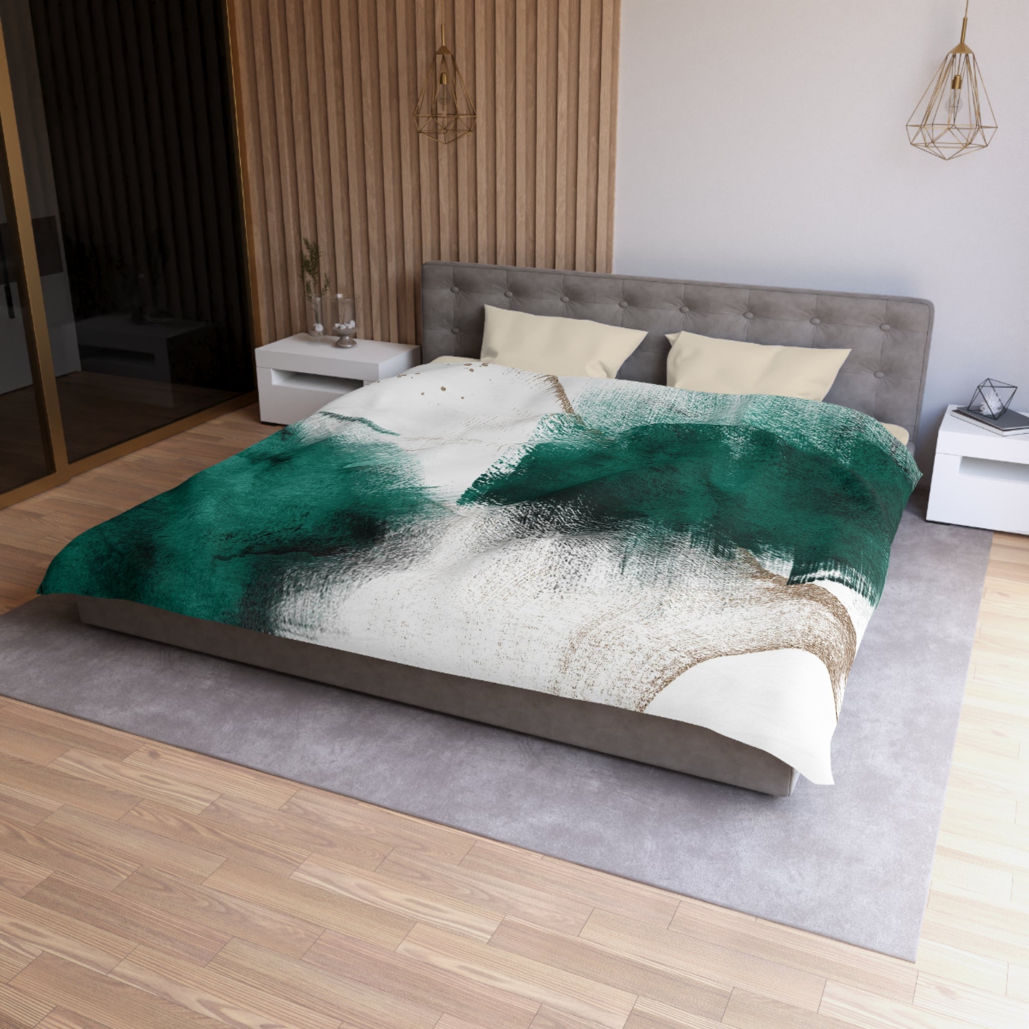 a modern bedroom with a large bed, a gray headboard, and a green and white abstract patterned comforter. The room has a wooden floor and white walls, creating a serene and stylish atmosphere.