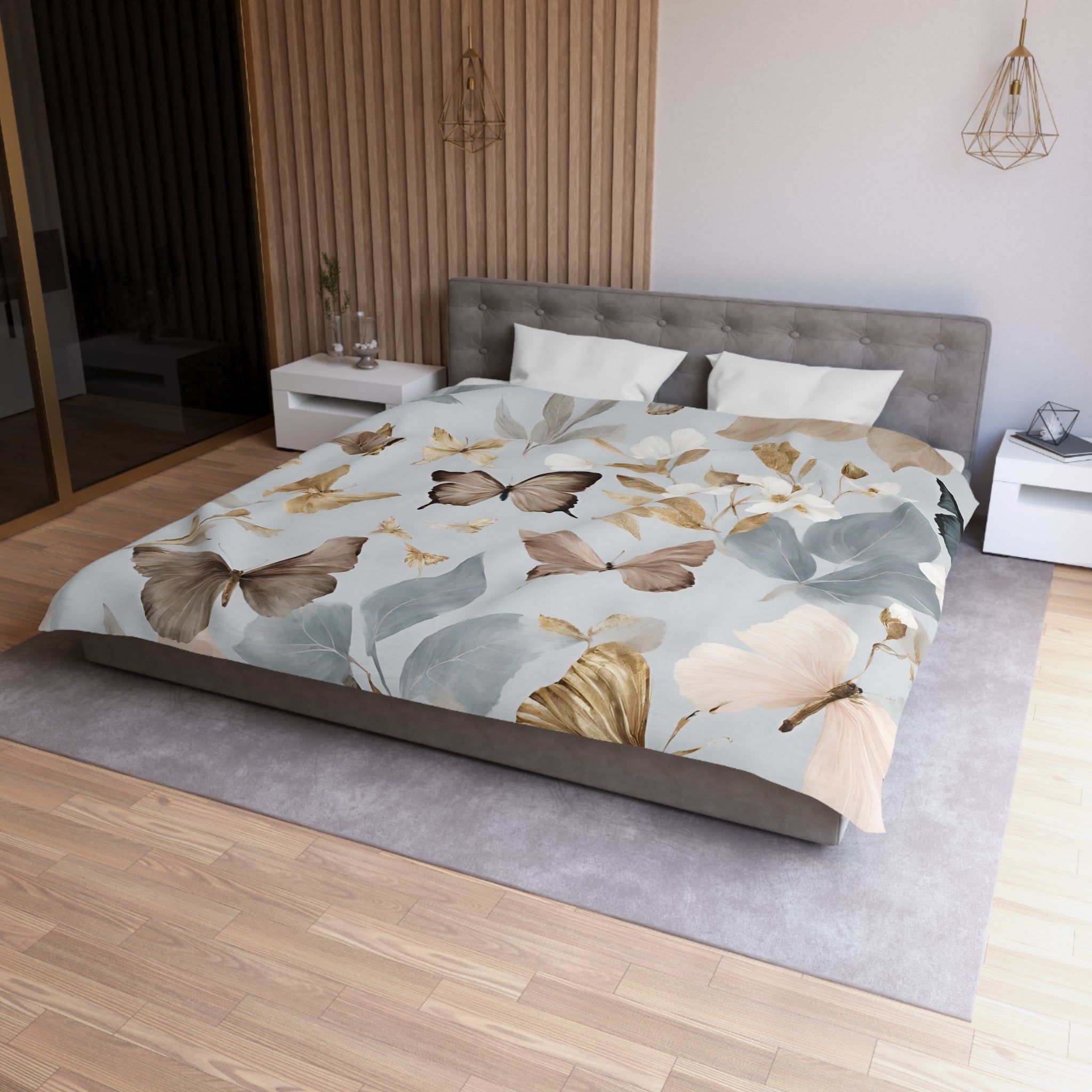 a modern bedroom with a large bed covered in a floral print featuring butterflies and leaves in shades of brown, green, and gray. The bed is positioned against a wall with a wooden panel, and there are two nightstands on either side of the bed. The room has a minimalist and clean design, with a gray carpet and a wooden floor.