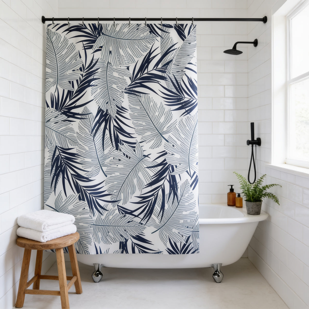 a bathroom with a white bathtub, a wooden stool, and a shower curtain with a tropical leaf pattern.
