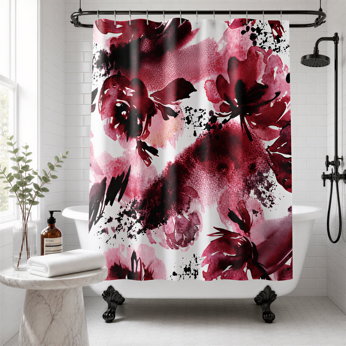 a bathroom with a white bathtub, a floral shower curtain with a bold red and black design, and a potted plant on a side table.