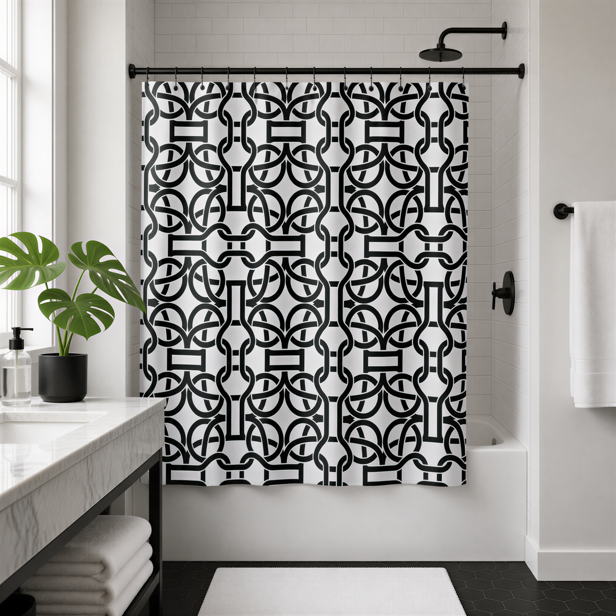 a modern bathroom with a black and white geometric patterned shower curtain, a white sink, and a black shower head.