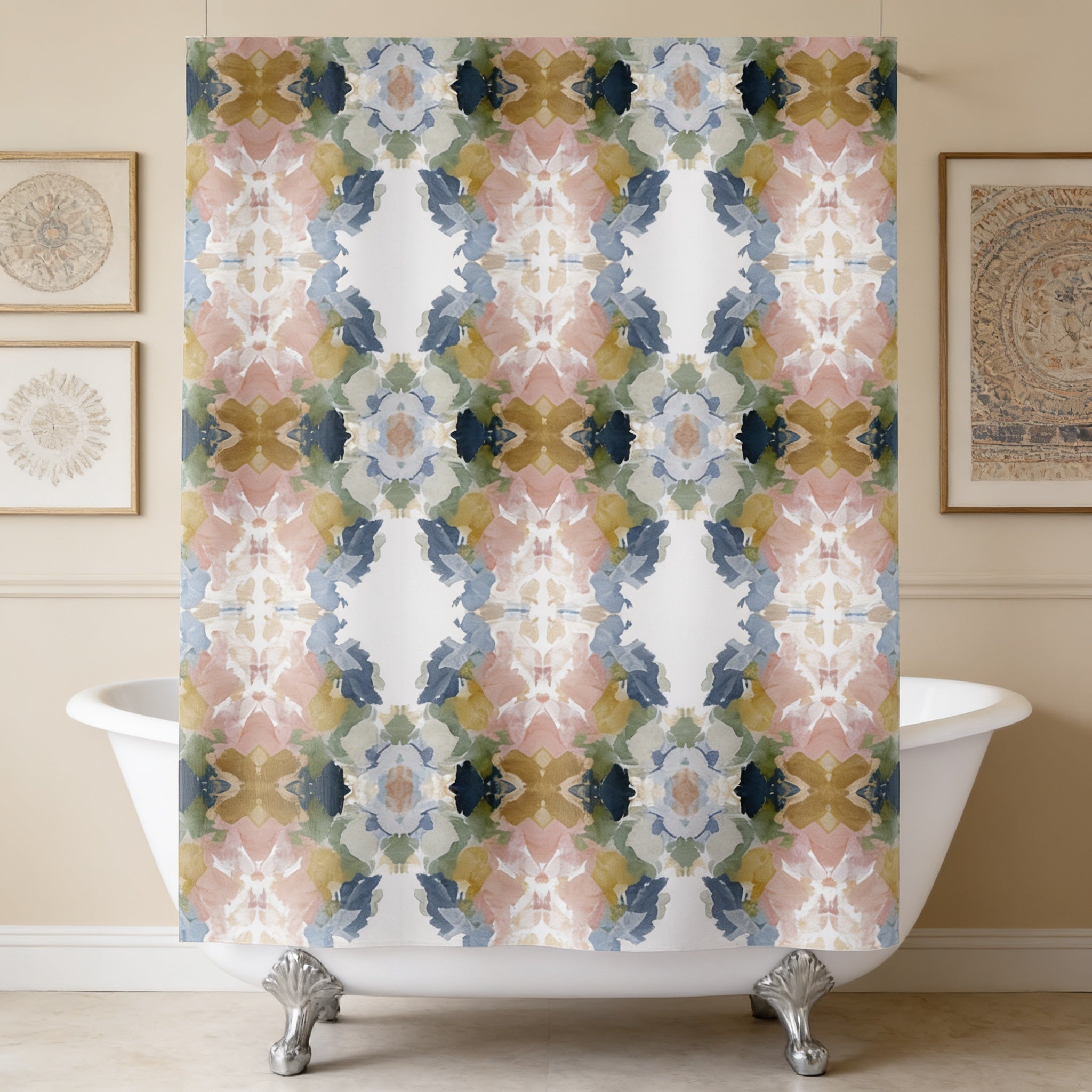 a bathroom with a white clawfoot bathtub, a colorful patterned shower curtain hanging from a rod above it, and framed pictures on the wall.