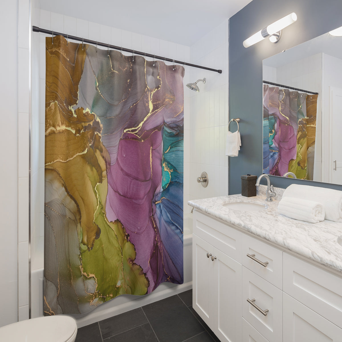 a modern bathroom with a white vanity, a colorful abstract shower curtain, and a marble countertop.