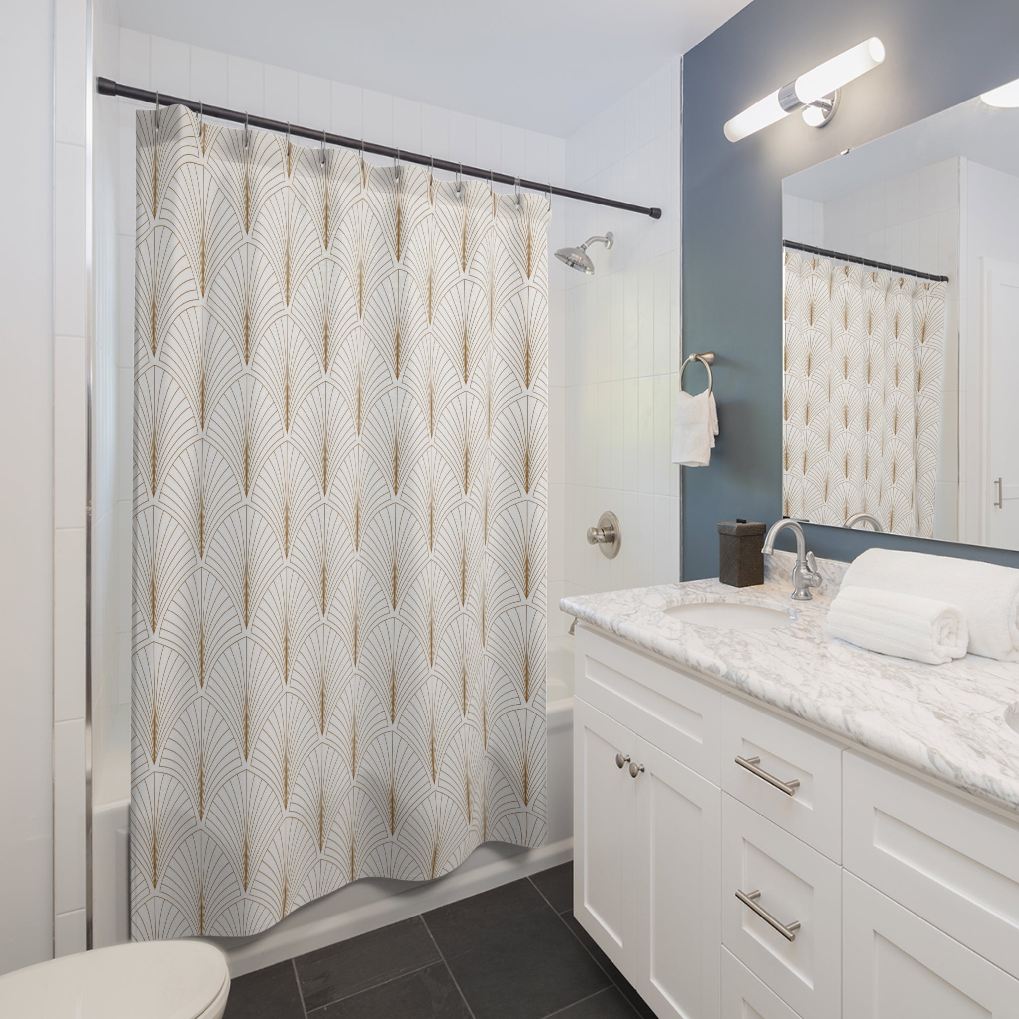 a modern bathroom with a white vanity, a shower curtain with a repeating gold and white pattern, and a mirror above the vanity.