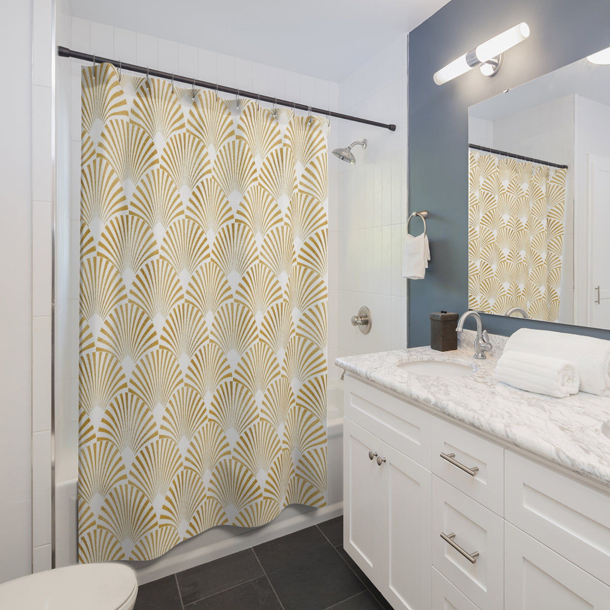 a modern bathroom with a white vanity, a gold and white patterned shower curtain, and a marble countertop.