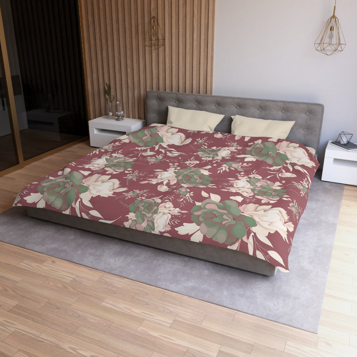 a modern bedroom with a large bed covered in a floral print comforter. The bed is positioned against a wall with a wooden panel. The room also features a nightstand, a pendant light, and a mirror.