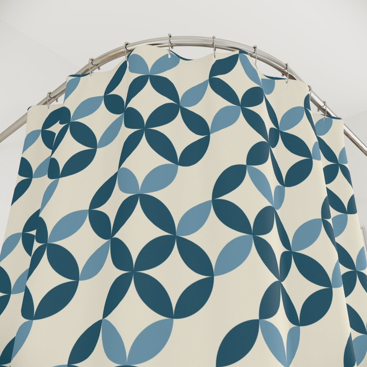 a shower curtain with a repeating pattern of blue and white circles.
