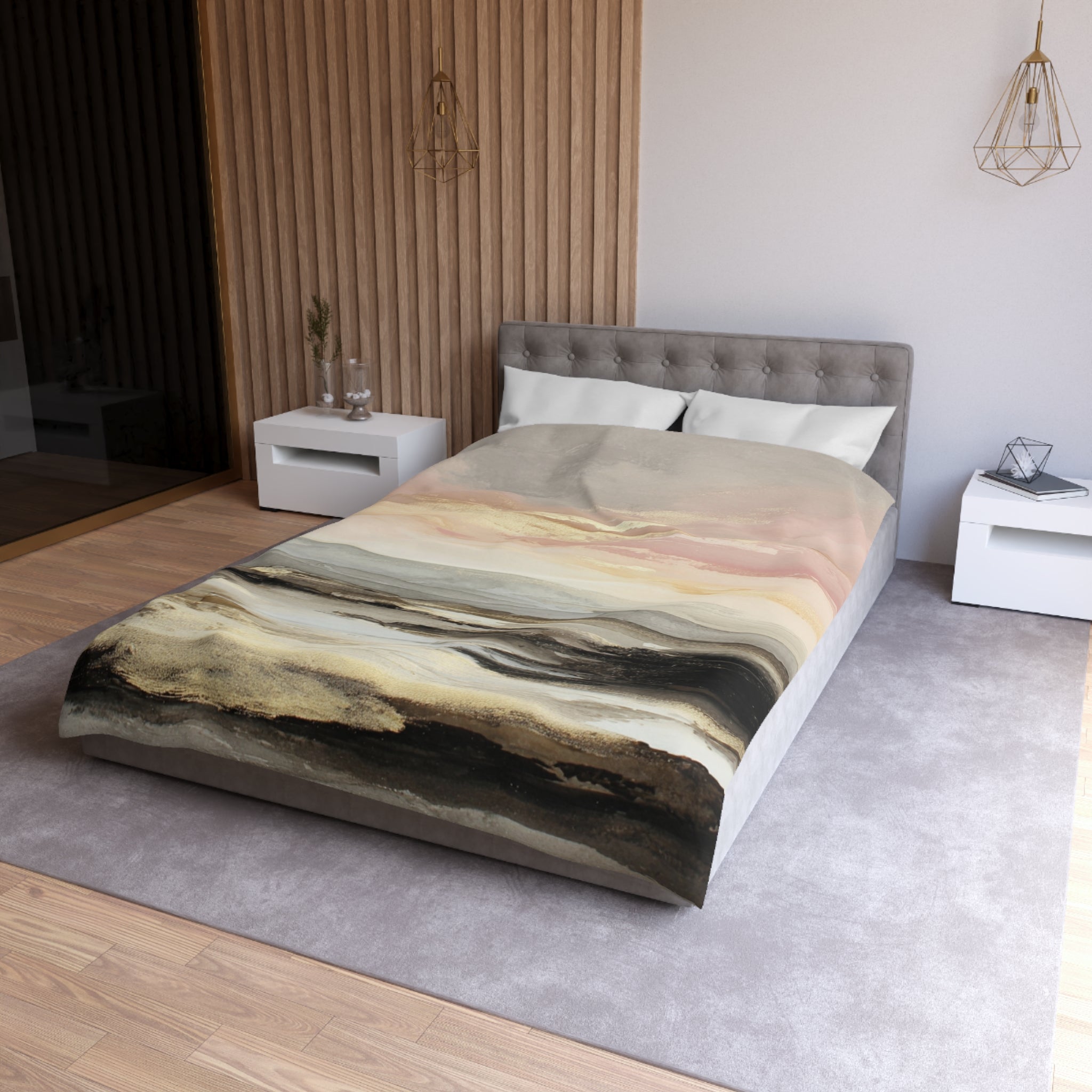 a modern bedroom with a large bed, a gray headboard, and a colorful abstract patterned bedspread. The room has a neutral color scheme with white walls and a gray carpet. There are also two nightstands and a pendant light hanging above the bed.