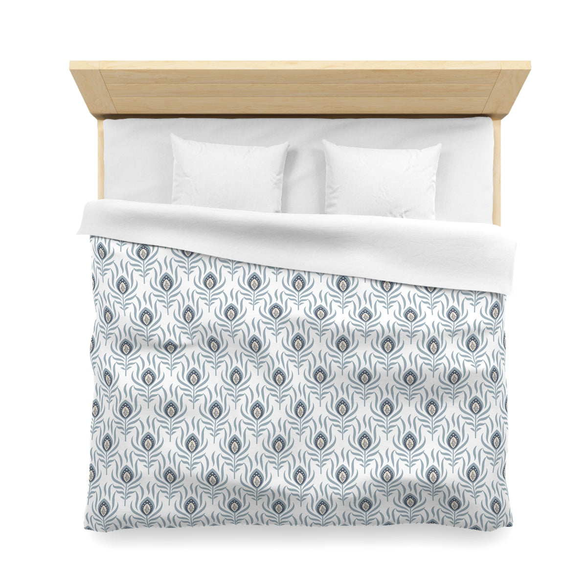 a neatly made bed with a patterned comforter and pillows.