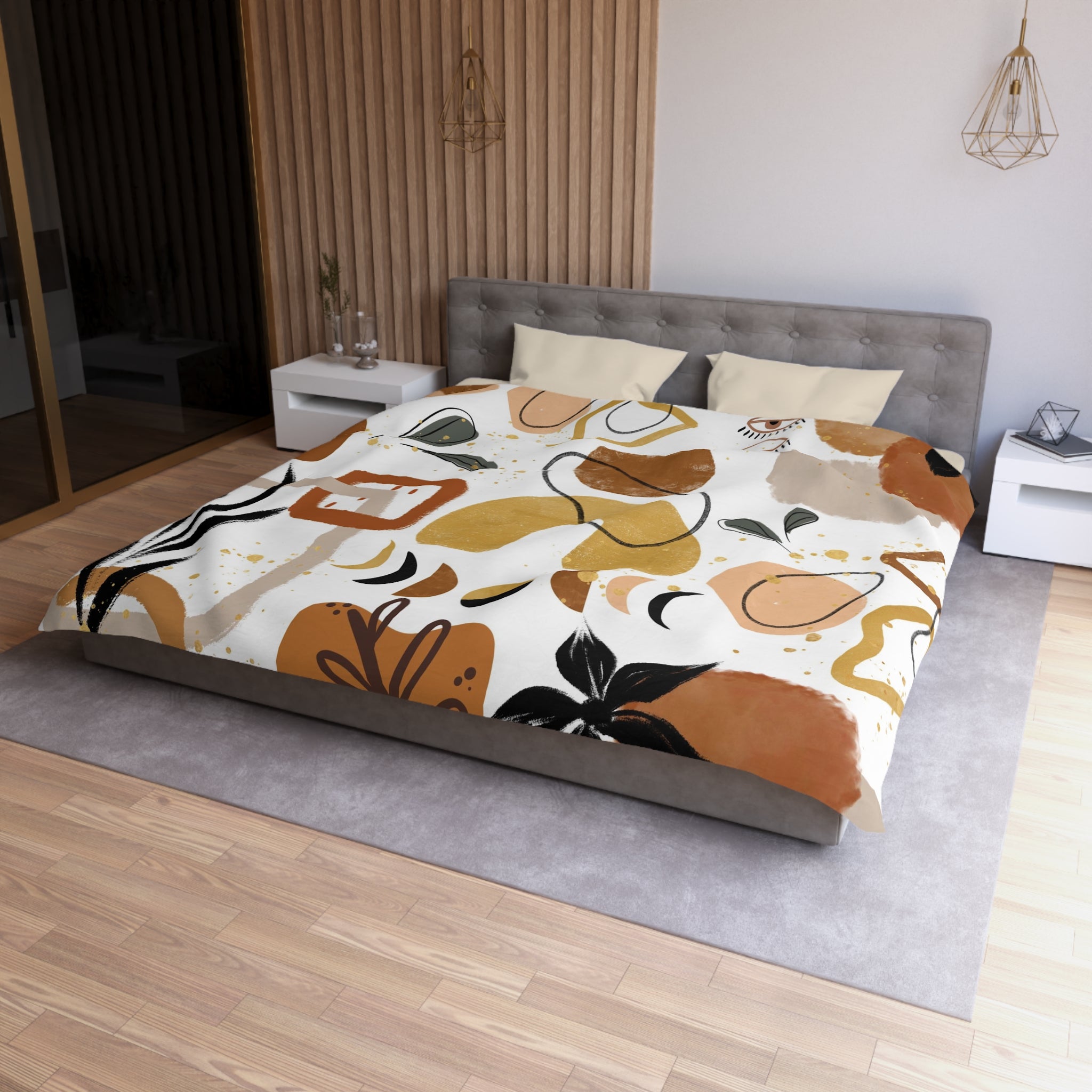a modern bedroom with a large bed covered in a colorful abstract patterned comforter. The room has a neutral color scheme with a gray headboard and white nightstands. There is a wooden floor and a large window in the background, allowing natural light to enter the space.