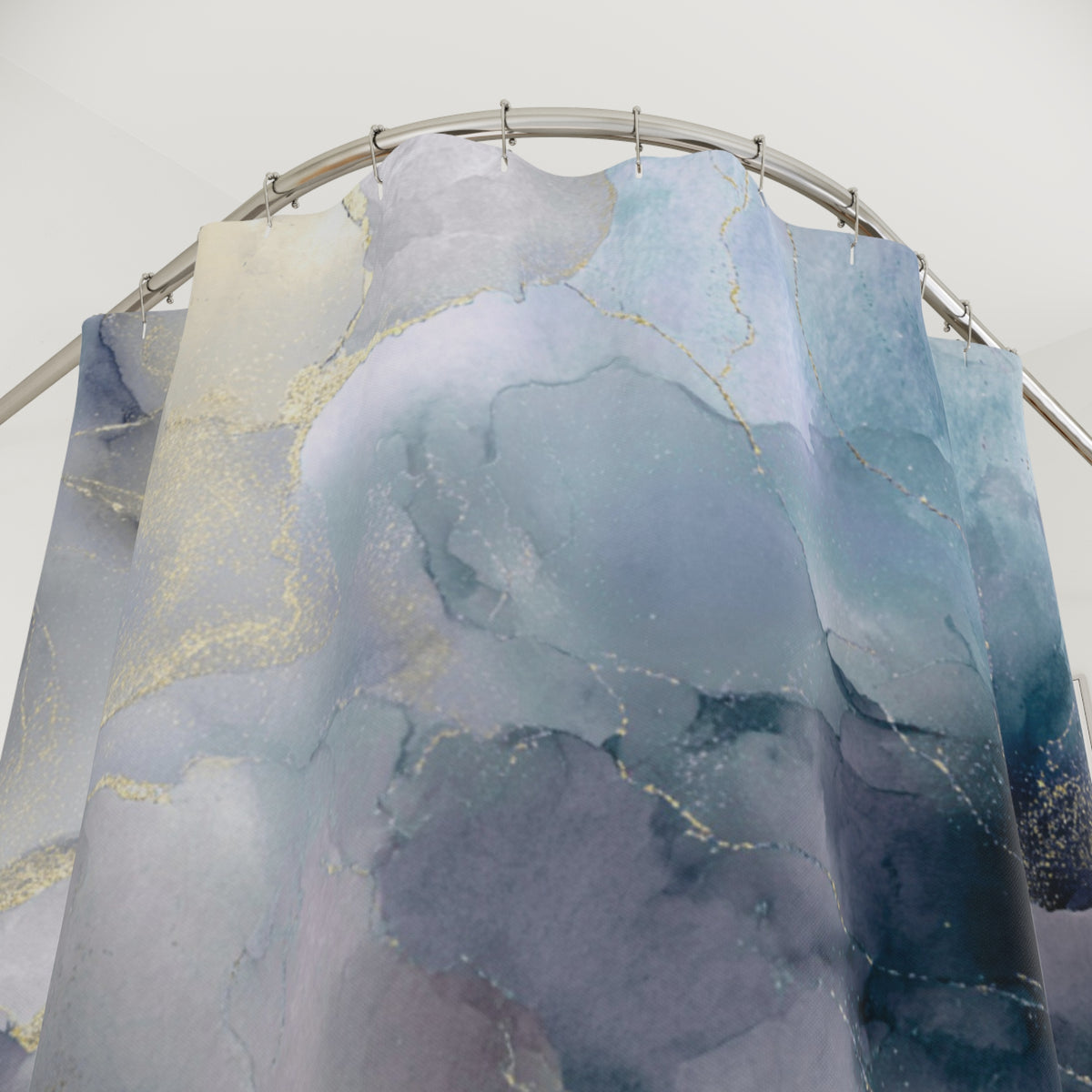 a shower curtain with a marble-like pattern in shades of blue and gray.