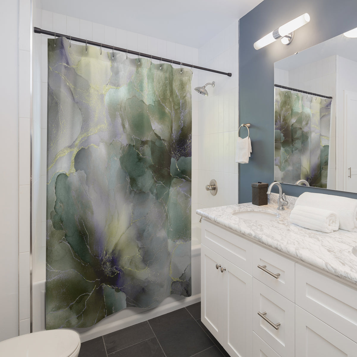 a modern bathroom with a white vanity, a large green and gray floral shower curtain, and a marble countertop.