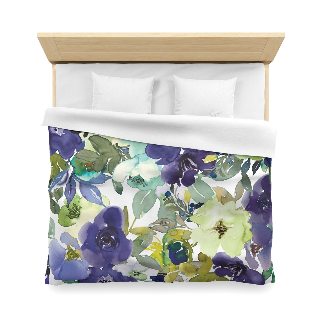a bed with a floral print duvet cover featuring a variety of colorful flowers and leaves.