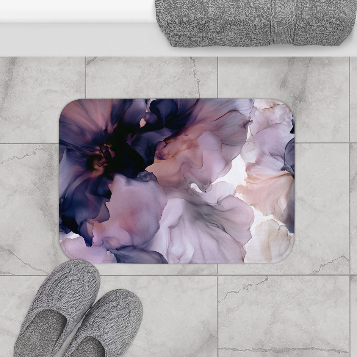 a bathroom rug with a flower design on it