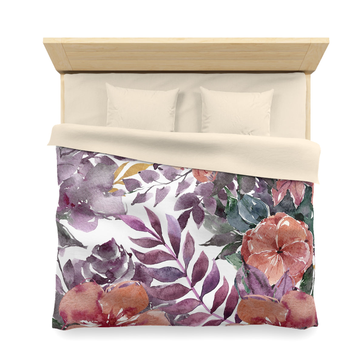 a bed with a floral print duvet cover featuring a variety of colorful flowers and leaves.