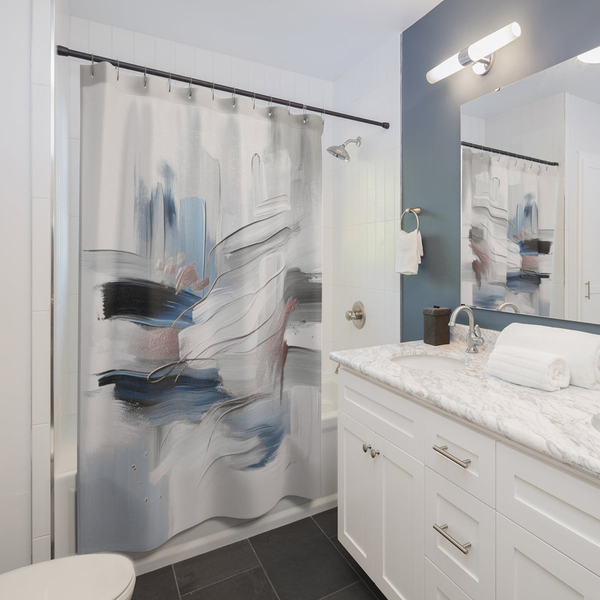 a modern bathroom with a white vanity, a shower curtain with an abstract design, and a mirror above the sink.