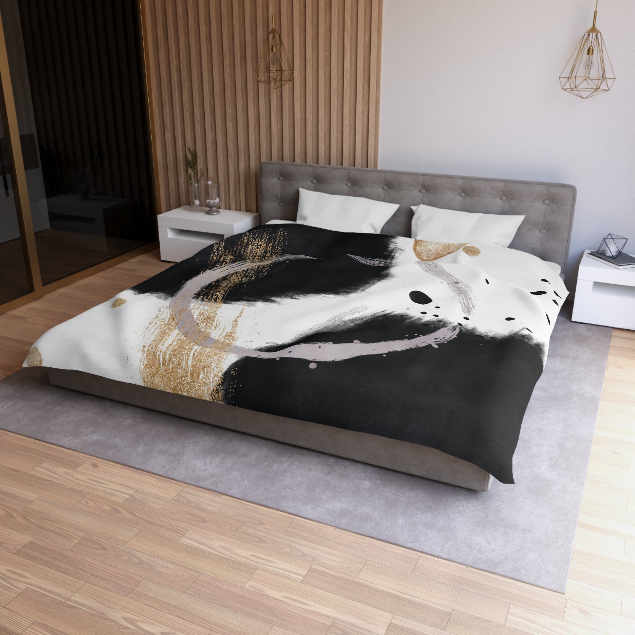 a modern bedroom with a large bed, a gray headboard, and a black and white abstract design on the bedspread.