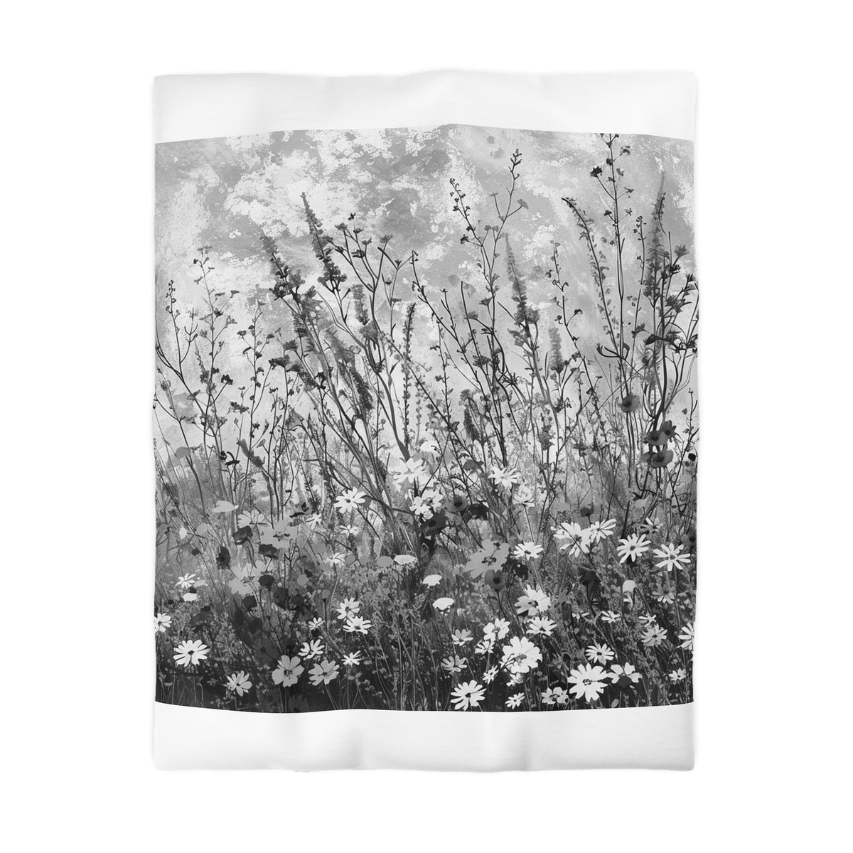 A black and white photograph of a field of tall grass and wildflowers.
