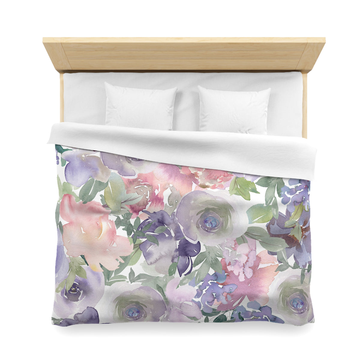 a bed with a floral print duvet cover featuring a variety of colorful flowers and leaves.