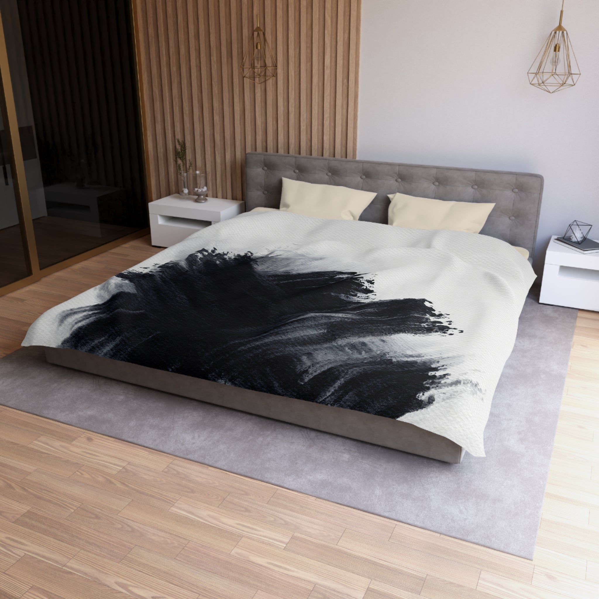 a modern bedroom with a large bed, a gray headboard, and a black and white abstract design on the bedspread.