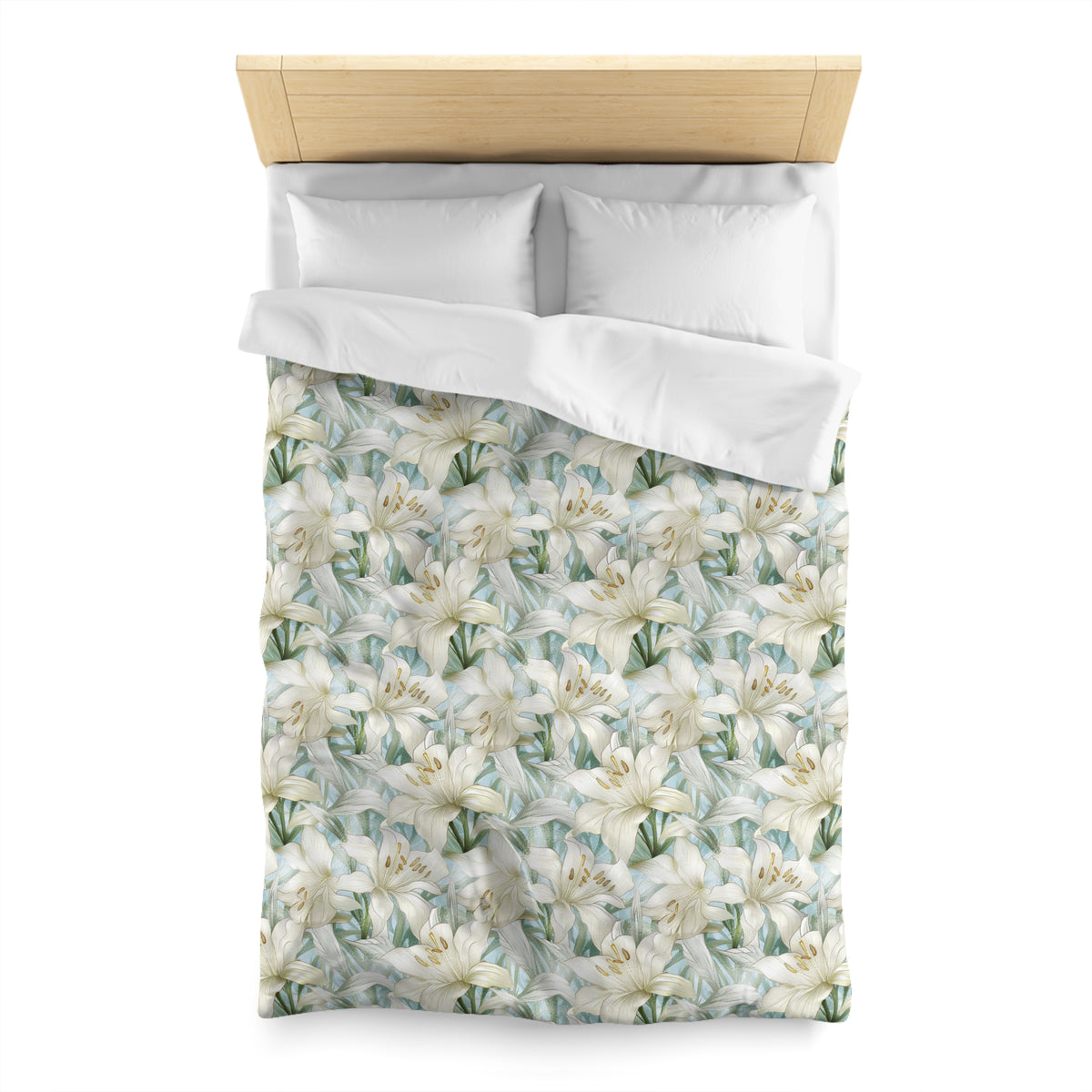 a neatly made bed with a floral patterned comforter and pillows.