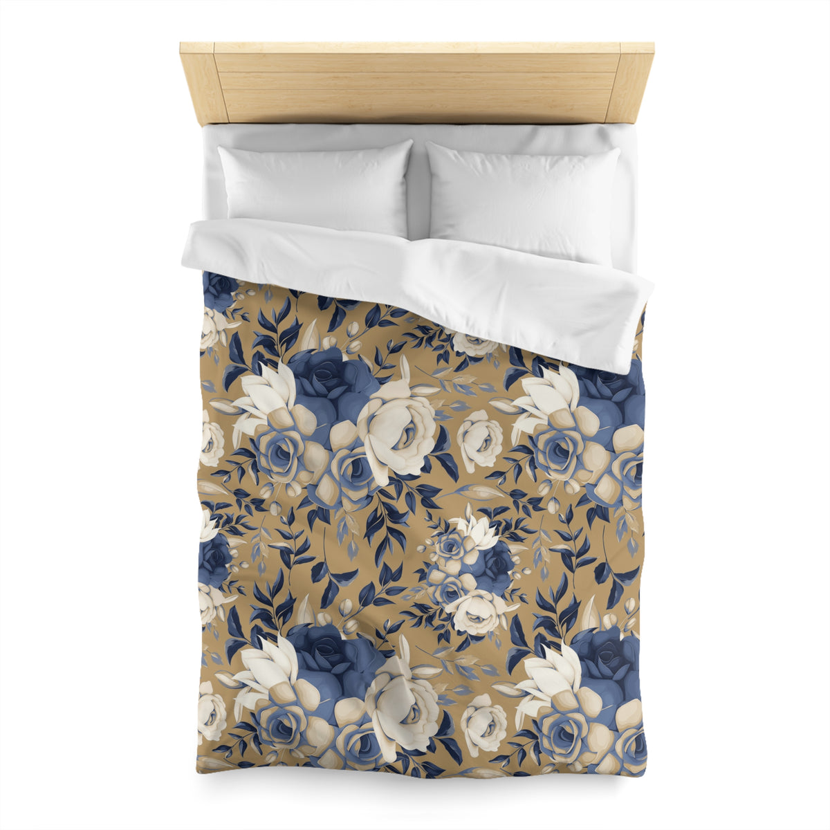 a bed with a floral patterned comforter and pillows.
