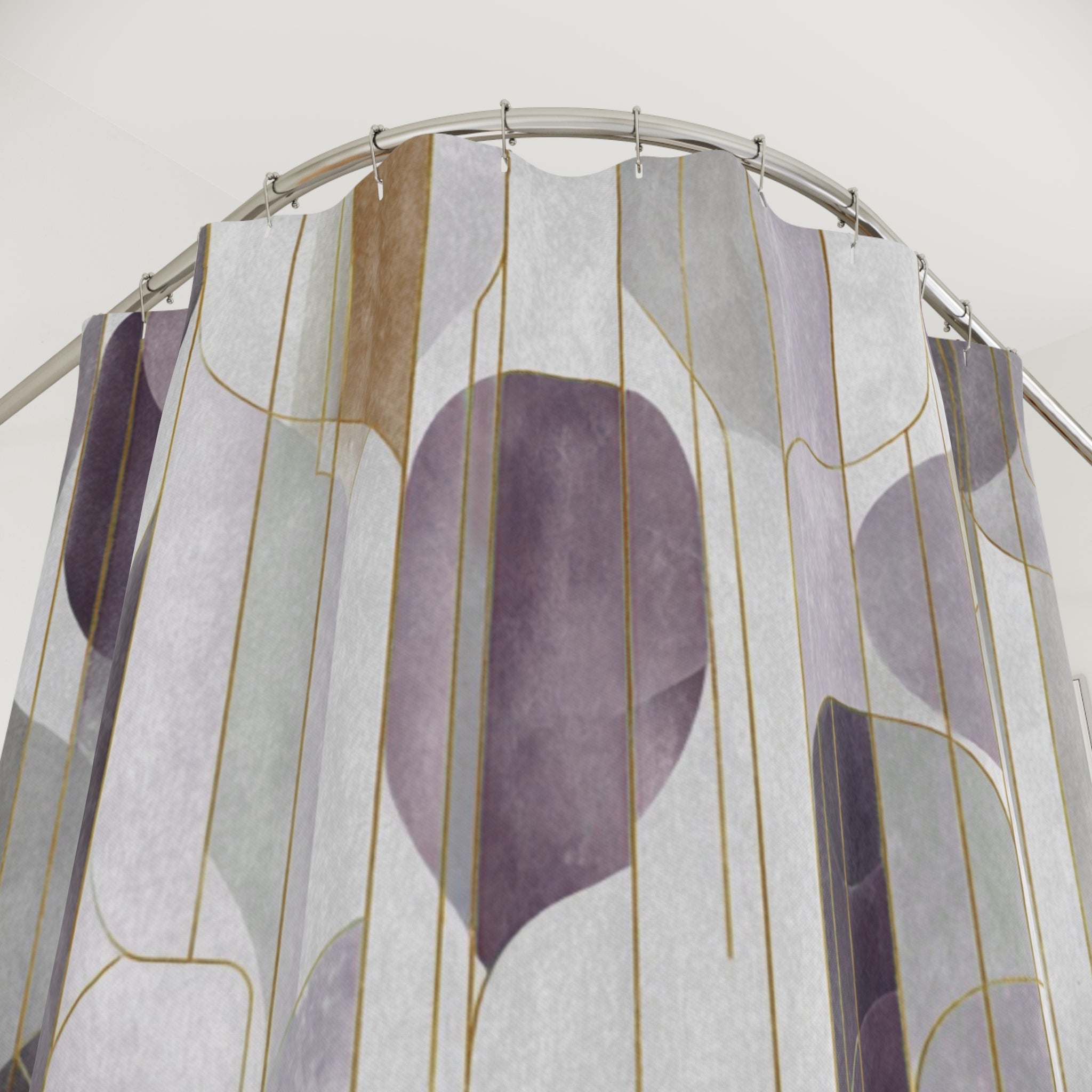 a shower curtain with a geometric pattern in shades of purple and gray.