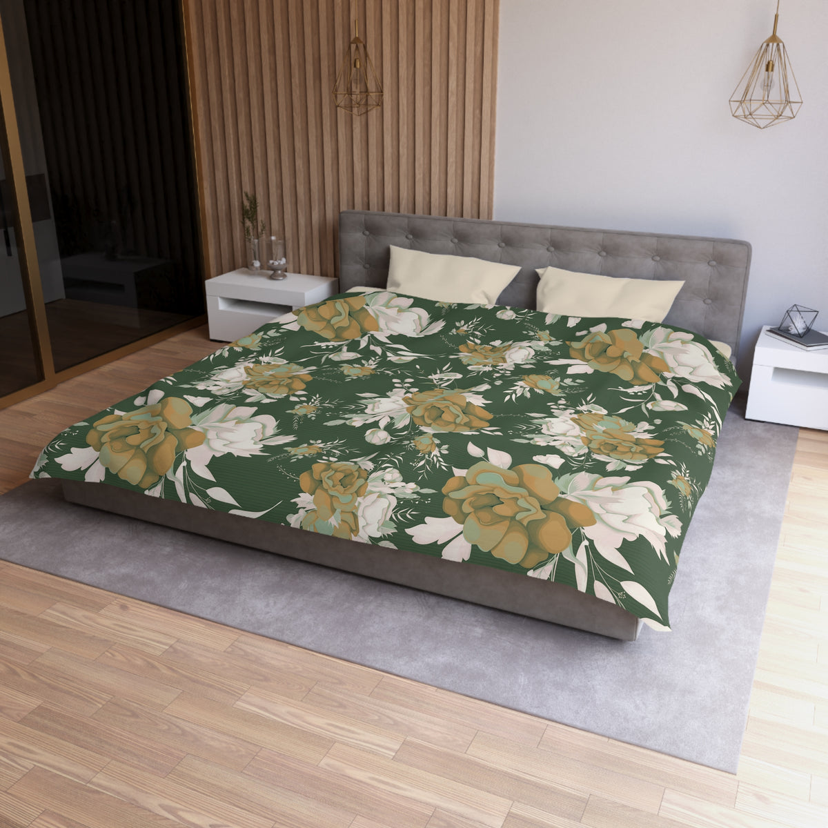 a modern bedroom with a large bed covered in a floral print comforter. The bed is positioned against a wall with a wooden panel. The room has a minimalist design, with a gray headboard and a white nightstand on each side of the bed. The floor is covered with a gray rug, and there is a pendant light hanging above the bed.
