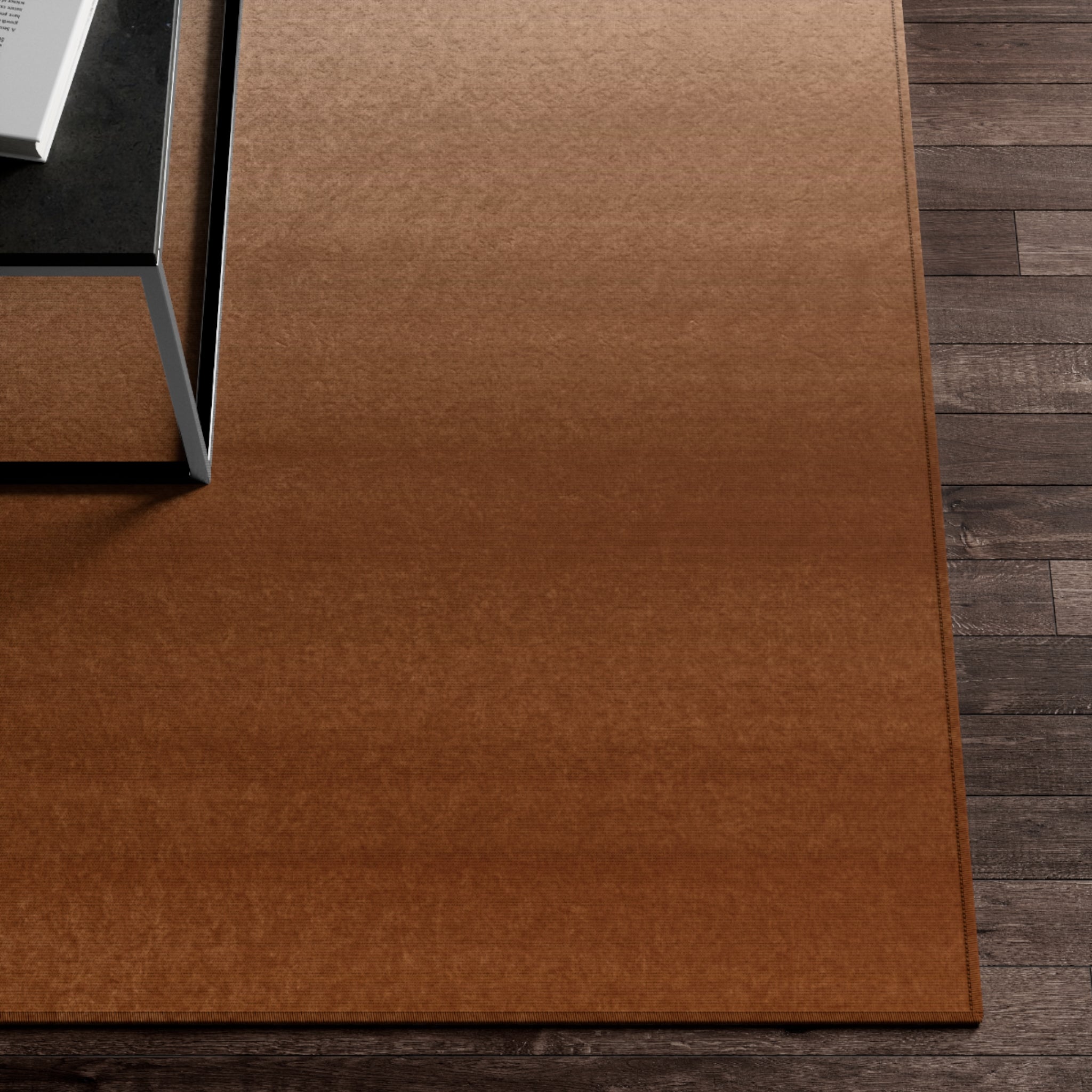 a brown rug with a computer on top of it