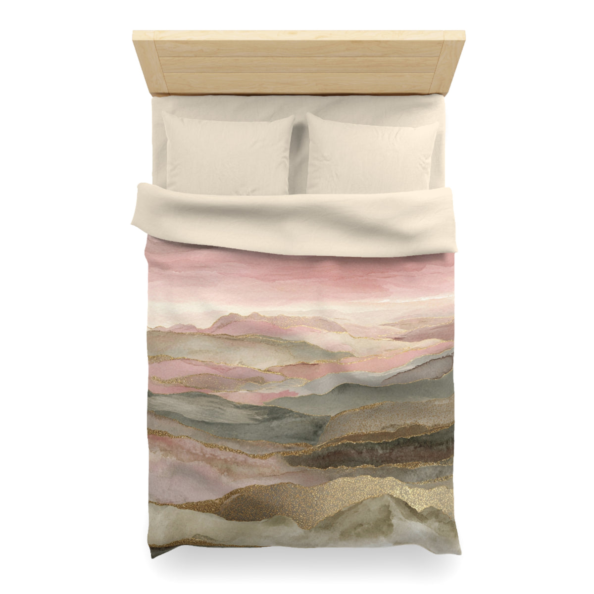 a bed with a pink and green watercolor print on the comforter, depicting a mountain landscape.