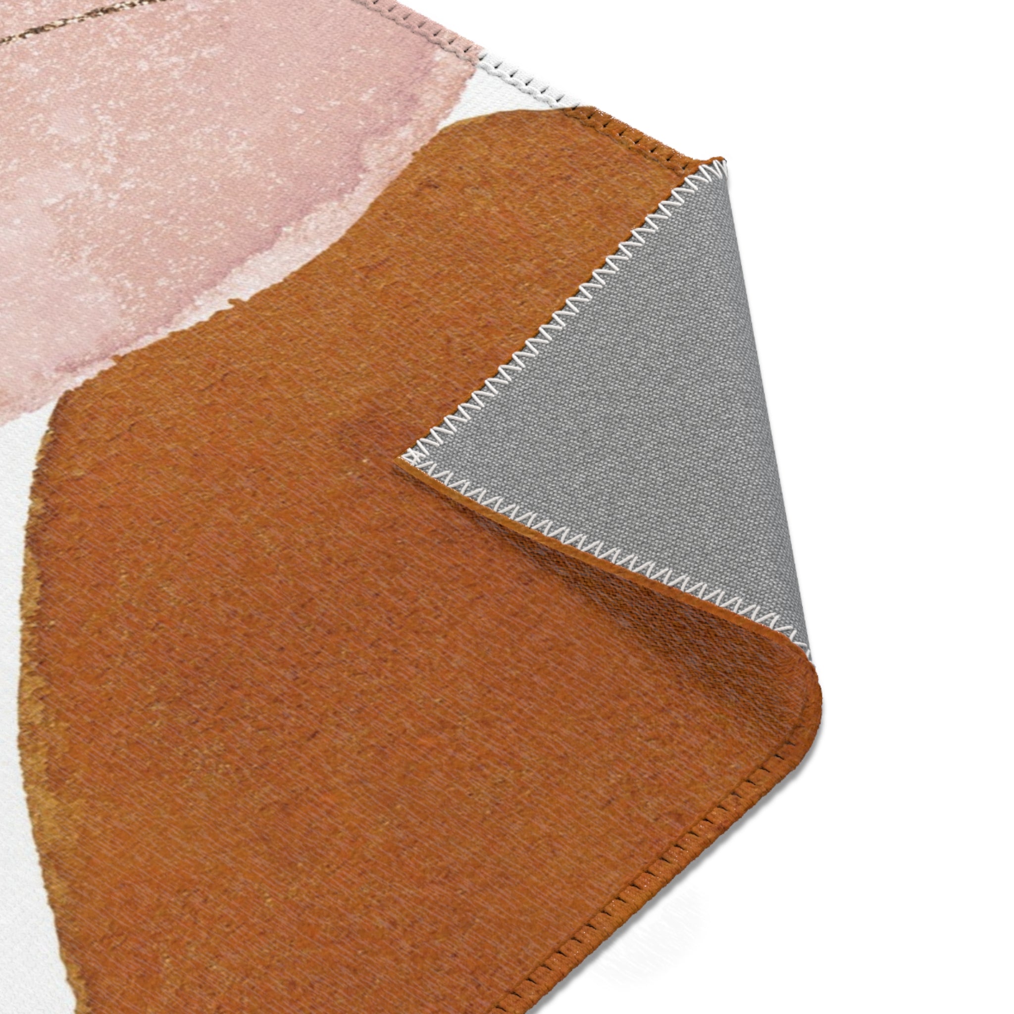 Modern rust, beige and blush pink abstract area rug styled with neutral decor