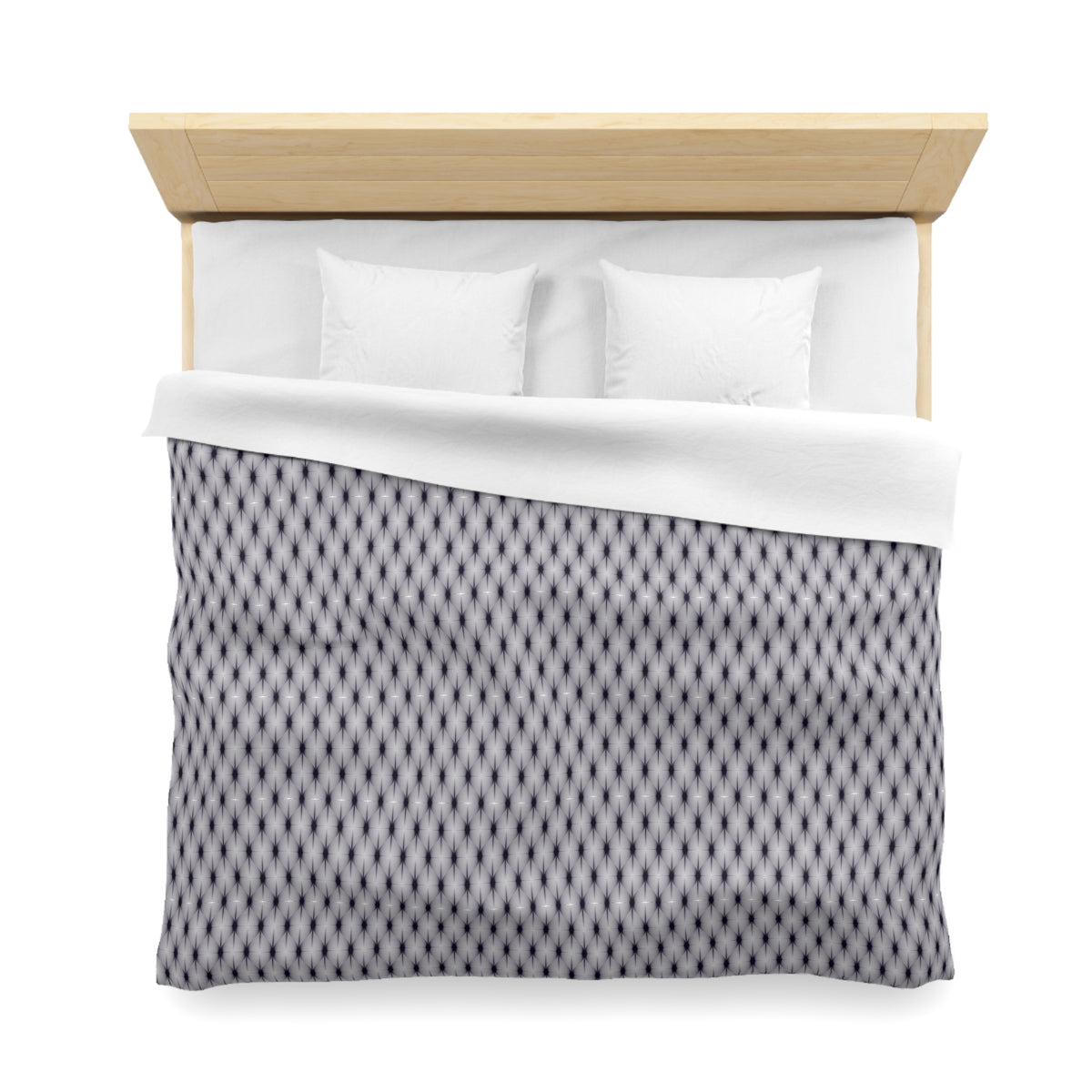A neatly made bed with a wooden headboard and a patterned comforter.