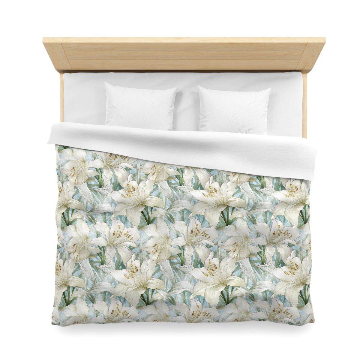a neatly made bed with a floral print duvet cover and two white pillows.