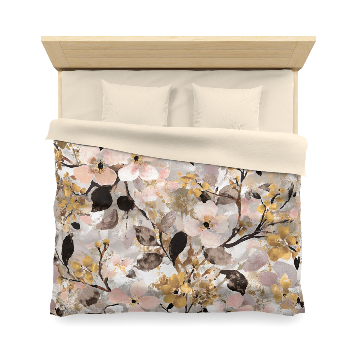 a bed with a floral print duvet cover and pillows.
