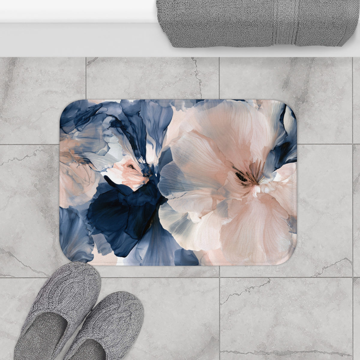 a bathroom rug with a flower design on it